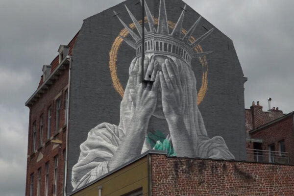 France: Statue of Liberty Covers Her Eyes in Mural Proter Trump